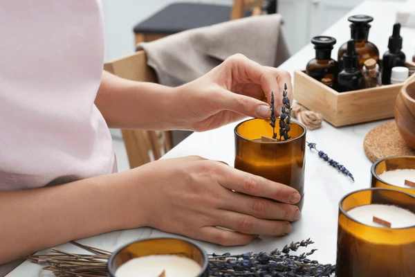 woman-decorating-homemade-candle-lavender-600nw-2060254436.jpg